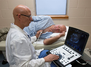 Brian Mergen, RCS, performs an Echo cardiogram, on patient, Fred Baldwin. CVHC and SMHC contract with Gritman Medical Center for the weekly service in Cottonwood and Orofino to save cardiac patients the drive time to other locations.